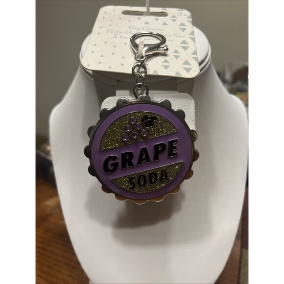 DISNEY GRAPE SODA CAP WITH CRYSTALS, FROM UP MOVIE, BAG CHARM KEYCHAIN NEW! - Picture 1 of 4